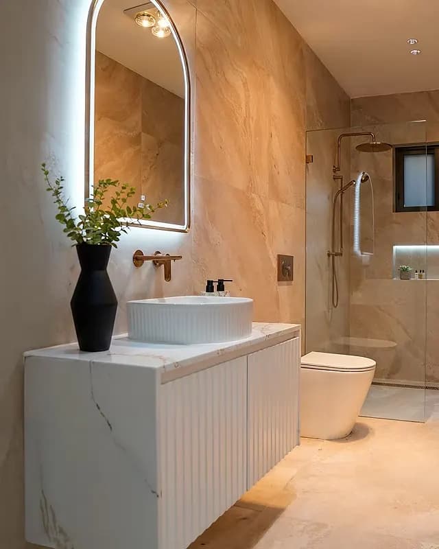 Completed ensuite with arched LED mirror and walk-in shower